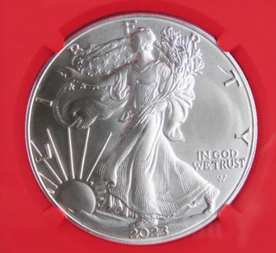 2023 Silver Eagle strike-through error showing eye-shaped foreign impression on obverse below LIBERTY